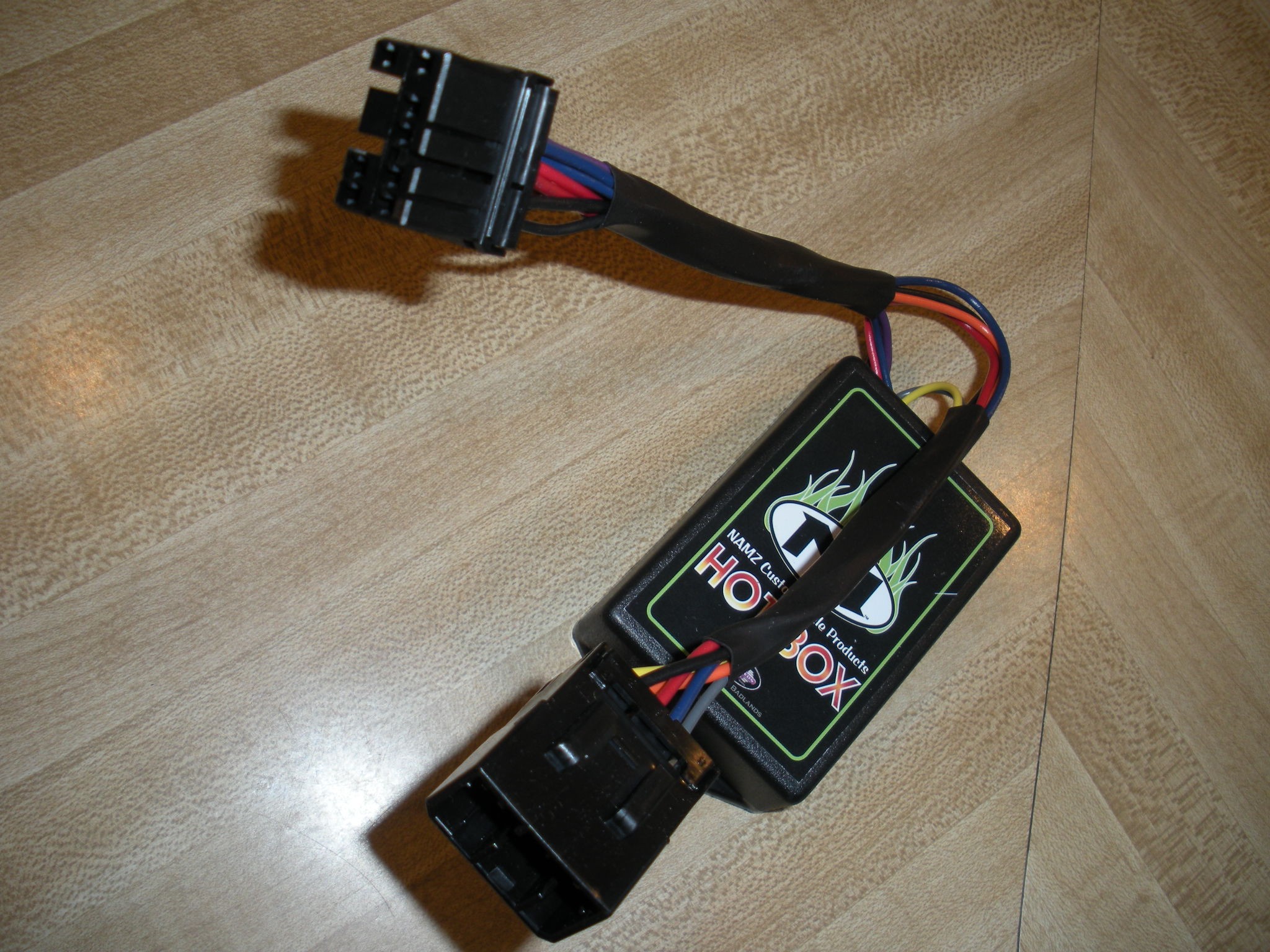 This module plugs in-line between the main fender harness and the rear fender harness. 